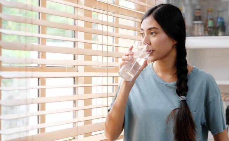 drinking water while standing